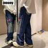 Mężczyźni dżinsy Patchwork wielopokometkowy para dżinsowych spodnie żebrakowe spodnie towarowe High Street Casual Male Streetwear 220720