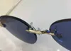 0331s Randlose runde Sonnenbrille Silber Blaue Linse 18K Rahmen Sonnenbrillen Damen Herren Sommermode Sonnenbrille Shades UV400 Brillen