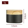 2022 5G Liten svart glasburk Matte svart med plastlockflaskor Cap Bamboo Wood Strain Round Wax Cream Cosmetic Container 5ml Custom