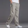 Mens casual Cargo Cotton pants men pocket loose Straight Pants Elastic Work Trousers Brand Fit Joggers Male Super Large Size 6XL 220704