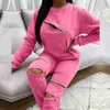 Fashion New Zipper Hollow Out Set Set Set осень-зимние женщины Элегантные вершины O-образного выявления и повседневные брюки Ladies Streetwear Suits T220729