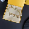 Orecchini con bracciale di design per donna Gioielli di lusso cerchi di perle Bracciale in oro f