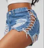 Short féminin Summer Tassel Denim fête Rave Femmes Sexy Club Skinny Lace Up Mid Waist Hole Rivet Button Black Short Jeans
