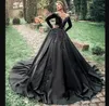 Einzigartige schwarze Gothic-Ballkleid-Hochzeitskleider im Prinzessin-Stil, Übergröße, Brautkleider, durchsichtiger Ausschnitt, Satin, lange Ärmel, Spitze, appliziertes Perlenkleid, Hochzeit