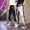 ジョガーズアニメプリントの男性用スウェットパンツファッショントレンドカジュアルカジュアル服ティーンエイジパンツハラジュク韓国ヒップホップストリートウェア220816