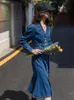 Robes décontractées tempérament robe en jean bouton de patchwork bleu pour femmes revers à manches longues cueillies