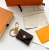 Nyckelringar Designer Letter Wallet Keychain Keyring Fashion Purse Pendant Car Chain Charm Brown Flower Mini Bag Trinka Gift Access9208340