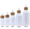 Opal White Glass Bottle 15ml 30ml 50ml com gotas de gotas de bambu 1 onças de madeira garrafas de óleo essencial