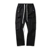 Pantalons pour hommes Black Cargo Vêtements pour hommes Pantalons évasés Europe et Amérique Poche High Street Harajuku Bell-Bas Mâle Sweatpan247o