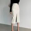 Slim rak faux läder kjol vårpaket höft lång pu jupe chic split utformad mode solid mujer faldas 220401