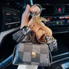 Leather Key Chains Rings Jewelry Brown Flower Plaid Tassel Coin Purse Keyrings Holder Fashion Mini Storage Handbag Keychains Accessories Cute Bag Pendant Charms