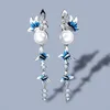 Boucles d'oreilles à fleurs bleu et blanc élégants