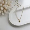 Collier tridimensionnel rétro européen et américain coeur d'amour petit coeur en or chaîne clavicule chance en acier titane plaqué protection de couleur 14K