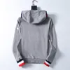 3 colori Giacca da uomo classica Cappotto con logo del braccio Giacca firmata Giacca da uomo Cappello a righe Cappotti di design Maglione con cappuccio autunno Giacche di alta qualità Asiatico M - XXXL