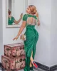 2023 Elegant Green Aso Ebi Evening Dresses 2021 Kort ärmar sjöjungfru Satin pärlstav sexiga tofsar tillbaka med slitsformella festklänningar