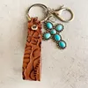 Keychains Vintage Echt lederen emboss Bloempolspolspompels Pompoen Blossoms Turquoise Cross Keychain Hoge kwaliteit Key Chain WholesalKeychai