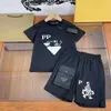 Vestiti estivi di lusso per bambini Set cotone manica corta ragazzi ragazze tessuto casual formale bambini stampa floreale tinta unita maglietta pantaloni 2 pezzi bambino o collo abbigliamento bambino magliette