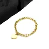 Europa Amerika Modestil Herren Damen Damen Titanstahl 18 Karat Gold Dickes Kettenarmband mit G-Initialen Herz-Pentagramm-Charm