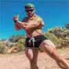 الرجال للياقة البدنية كمال الأجسام السراويل القصيرة رجل الصيف تجريب الذكور شبكة التنفس السريع الجاف الجاف الجافة jogger شاطئ السراويل القصيرة 220526