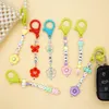 Butterfly Flower Keychain Trendy Acrylic Bead Lanyards Keyring Mobiltelefonkedjor för kvinnors bilnycklar Väska Dekorhänge