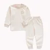 Pasgeboren babyontwerpers jongens meisje kleding set pyjama sets puur 100% katoenen o-neck buckle wollen vaste stof slaapkledingpak pyjama toppen met lange mouwen en broek choth