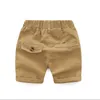 Baby pojkar kläder sommar barn kort stil byxor cool pojke casual outwear elastic mjuk khaki shorts bomull ren färg shorts 220707