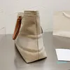 Diseñador - Bolso de compras a rayas Bolso de mano de lona Bolsos de cubo Letras bordadas Impresión de cuero Cerradura portátil Decoración Bolsos de gran capacidad Alta calidad