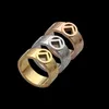 Europa Amerika Fashion Style Men Lady Women Titanium Steel gegraveerde Hollow Out Letter 18K Gold Lovers Ring Rings 3 Color