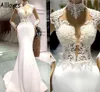 Vestidos modestos de cetim de casamento de sereia com ilusão de mangas compridas apliques de renda alta de colarinho de piscadela