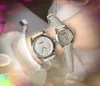 Crimen Pareja popular Mujeres Hombres Reloj 39 mm 32 mm Moda de lujo Mujeres Banda de cuero genuino Movimiento de cuarzo Reloj de pulsera de ocio Regalos de Navidad y San Valentín