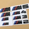 شارات 1pcs لامعة أسود 3D ABS M M2 M3 M4 M5 Chrome Emblem Carning Fender Trunk Badge Logo Sticker for BMW Quality Genidation253R336R