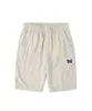 Heren shorts paarse vlindernaalden shorts 2022 mannen vrouwen borduurwerk 1 1 high street naalden shorts knop pocket awge rijbroek t220825