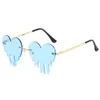 Droppande hjärtformade solglasögon för kvinnors hjärtglasögon trendiga glasögonfest Funnig färgglada Rimless Cut-edge-glasögon