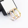 Donia luxe bangle glanzende brief overdreven titanium staalarmband European en Amerikaanse modeontwerpster geschenkdoos