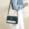 Bag Cnoles läder Kvinnor 2022 Nya sommarhigh-end kontrast Small Bee Cross Shoulder Small Square Bag