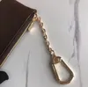 Luxury Key Pouch Pouch de cuero Purse Cles Diseñador Fashion Womens Mens Key Ring Holder Coned Moned Moni Mini Billet Bag Charm Brown Canvas001
