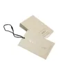 Precio de fábrica personalizado de lujo de papel de cartón blanco etiqueta colgante cartón etiqueta oscilante ropa