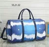 Designers moda 55cm Duffel sacos de luxo homens femininos sacos de viagem de couro bolsas de couro grande capacidade de espera de bagagem