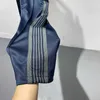 Pantaloni con aghi blu navy Pantaloni da jogging da donna da uomo Pantaloni sportivi con tasca con cerniera con coulisse e ricamo a farfalla in materiale morbido