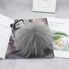 Lyxigt varumärke 15 cm Real Fur Ball Pom Poms Pompom Högkvalitativ Keychain Key Chain Metal Ring Pendant för kvinnor F281 220411