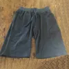 Pantalons de shorts pour hommes solides joggers plage de plage simple à fermeture éclair simple coton coton pantalon décontracté avec badge