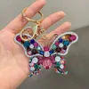 Crystal Butterfly Keychain Glitter Ringue de metal para mulheres Moda Moda Chic Saco de mochila pingente de mochila Acessórios