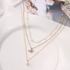 Collier de perles papillon multicouches pour femmes, ras du cou en perles dorées, bijoux à la mode