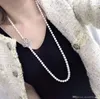 عالي الجودة Zircon micro inlay DIY Pearl Necklace Camellia Flower Clasp Clasp Long Sweater Stain Clasp Clasp