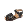 Cross-bundna Summer Girls Beach Shoes Classic Black White Pink Roman Sandals Cut-Outs barnflicka Sandaler för barn E04272 G220523