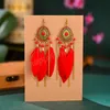 Boucles d'oreilles ethniques Boho longues plumes pour femmes Bijoux d'été Vintage en alliage d'or chaîne gland boucles d'oreilles pendantes