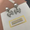 Designer Women Dangle Kolczyki luksusowe biżuterię Bowknot Pearl Stud żyrandol żyrandol damski prezent