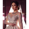 Crystal Sparkly Pearls Long Sleeve Dubai Wedding Dresses Ball Gown Illusion Open Back Pekadning PEBSININERAD SAUDI ARABISK BRIDALKOBLER S S S S S S S S S