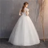 Andra bröllopsklänningar Ankomst Ezkuntza Kort ärm klänning spetsar o-hals upp bollklänning prinsessan vintage klänningar annan