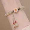 Jade runde Perlenstränge kleine Pfirsichblüten gewebte Perlenarmband weibliche Design Studentin Freundinnen Geschenk Armbänder